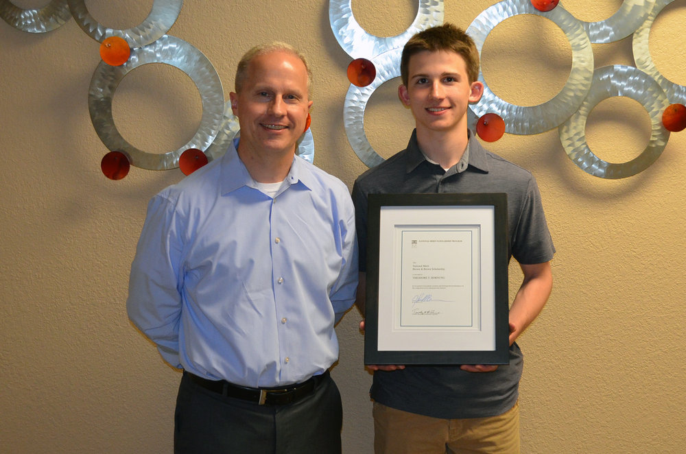 Theo Hurnung with father - Brown & Brown National Merit Scholarship
