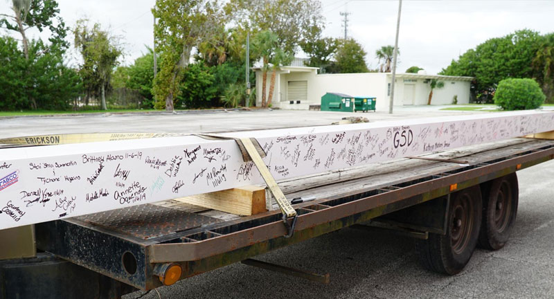 Beam on trailer for transportation to beach street campus