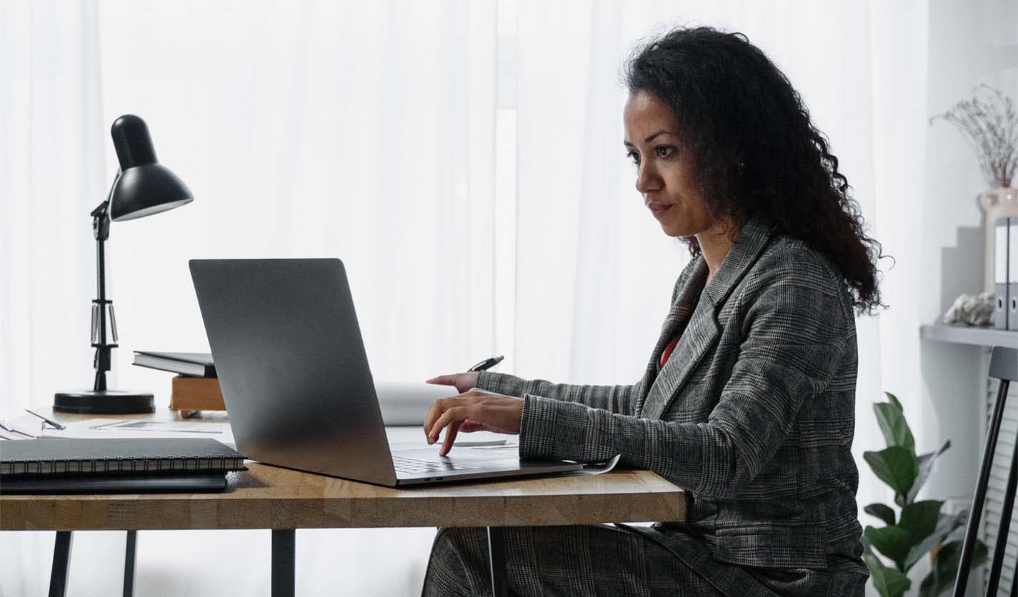 woman working on laptop at desk